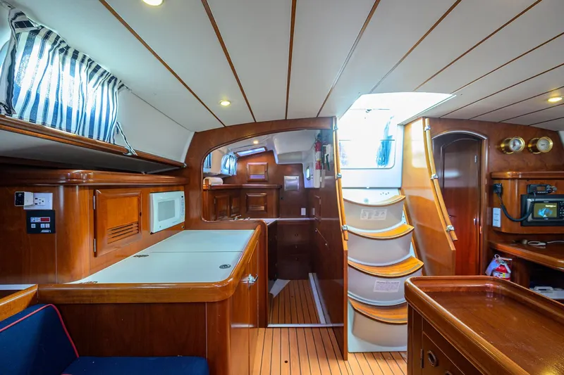 Windigo Yacht Photos Pics Interior of 2003 Beneteau 50 yacht with wooden finish and modern amenities.