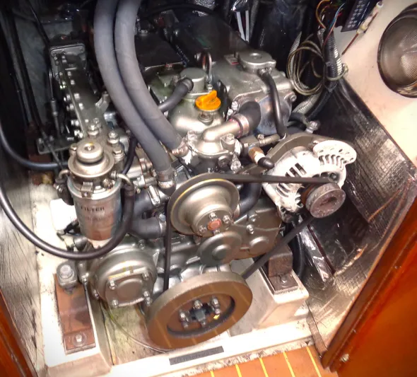 Indigo Yacht Photos Pics Engine compartment of a 2005 Pacific Seacraft 40 sailboat, showcasing mechanical components.