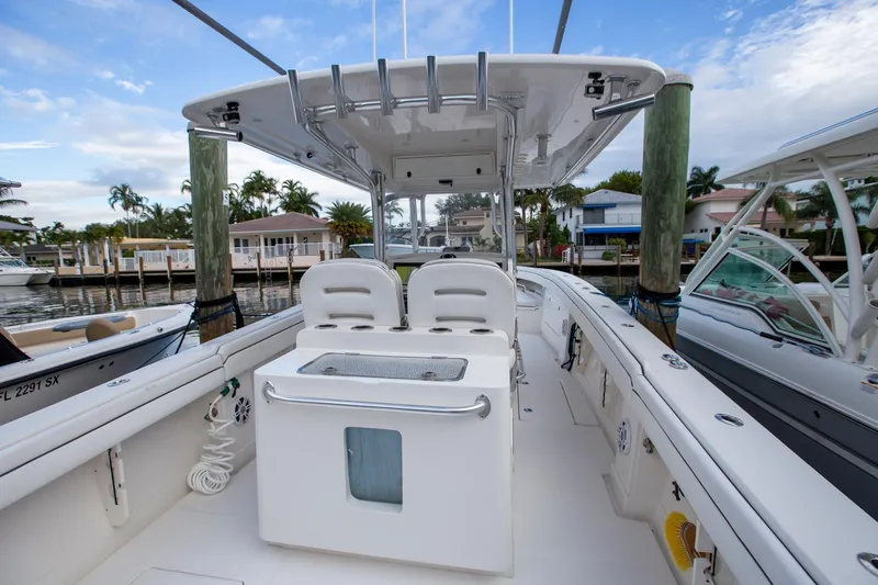 Bandit Yacht Photos Pics 2018 Jupiter 38 FS boat interior with seating and console, docked in a marina.