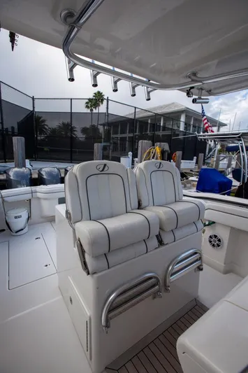Bandit Yacht Photos Pics 2018 Jupiter 38 FS boat interior with white cushioned seats and sleek design.
