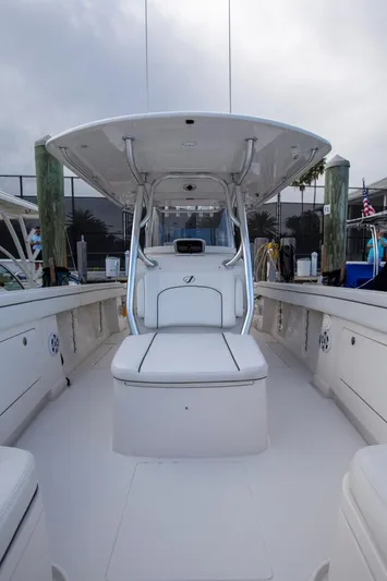 Bandit Yacht Photos Pics 2018 Jupiter 38 FS boat interior with seating and console, docked at marina.