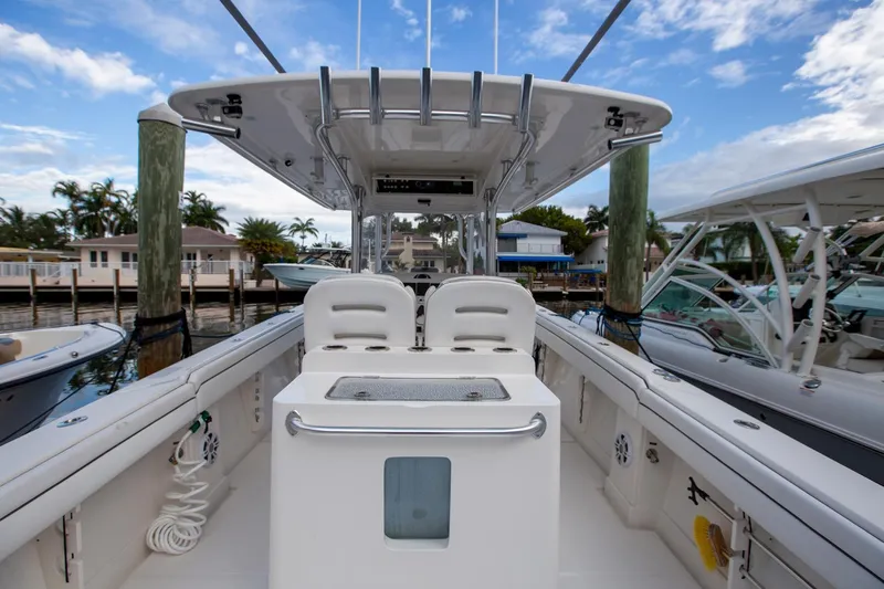 Bandit Yacht Photos Pics 2018 Jupiter 38 FS boat interior with seating and console, docked at marina.