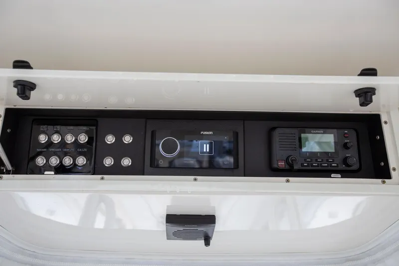 Bandit Yacht Photos Pics Control panel of 2018 Jupiter 38 FS boat with switches and electronic displays.