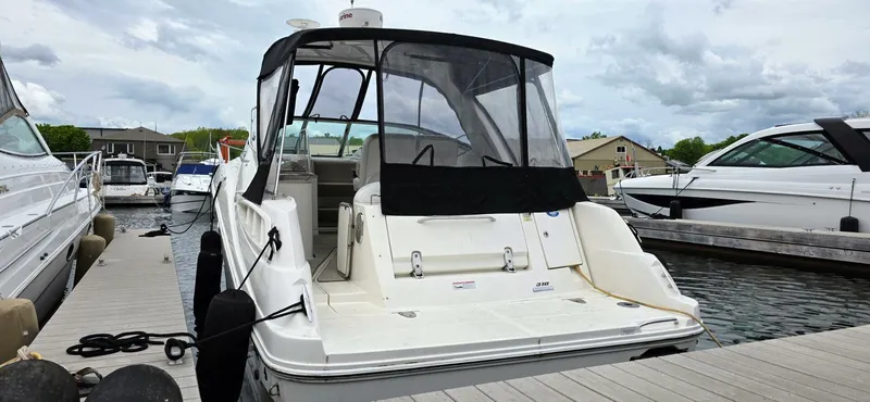  Yacht Photos Pics 2009 Sea Ray 310 Sundancer docked at marina, rear view with canopy.