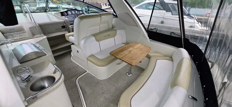  Yacht Photos Pics Interior of 2009 Sea Ray 310 Sundancer yacht with seating and table.