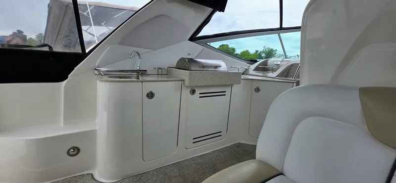  Yacht Photos Pics 2009 Sea Ray 310 Sundancer interior with kitchenette and seating area.
