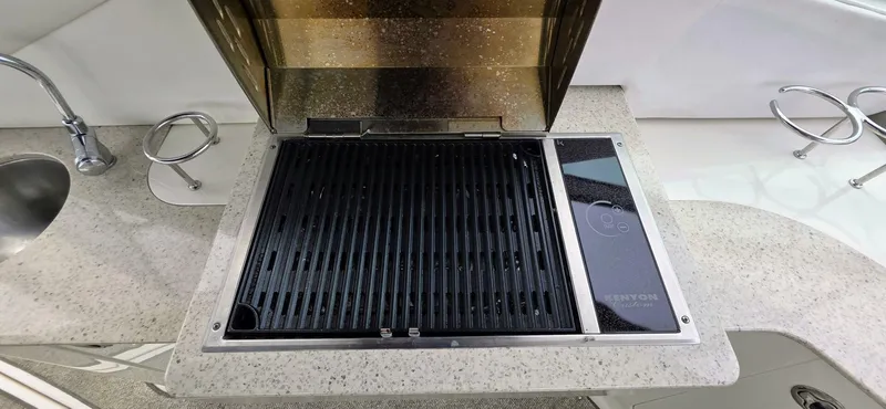  Yacht Photos Pics Outdoor grill and sink on 2009 Sea Ray 310 Sundancer yacht.