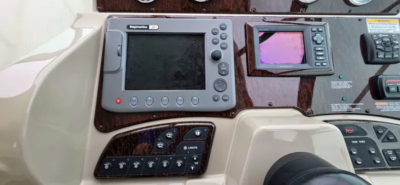  Yacht Photos Pics Control panel of a 2009 Sea Ray 310 Sundancer boat with navigation equipment.