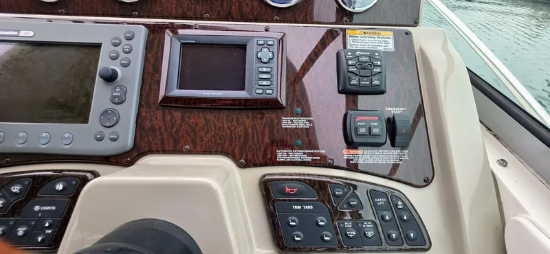  Yacht Photos Pics Control panel of a 2009 Sea Ray 310 Sundancer boat with navigation instruments.
