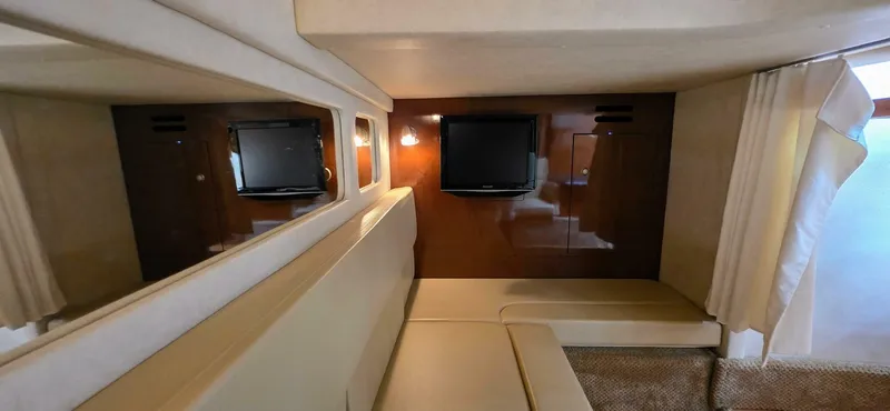  Yacht Photos Pics Interior of 2009 Sea Ray 310 Sundancer with TV and seating area.