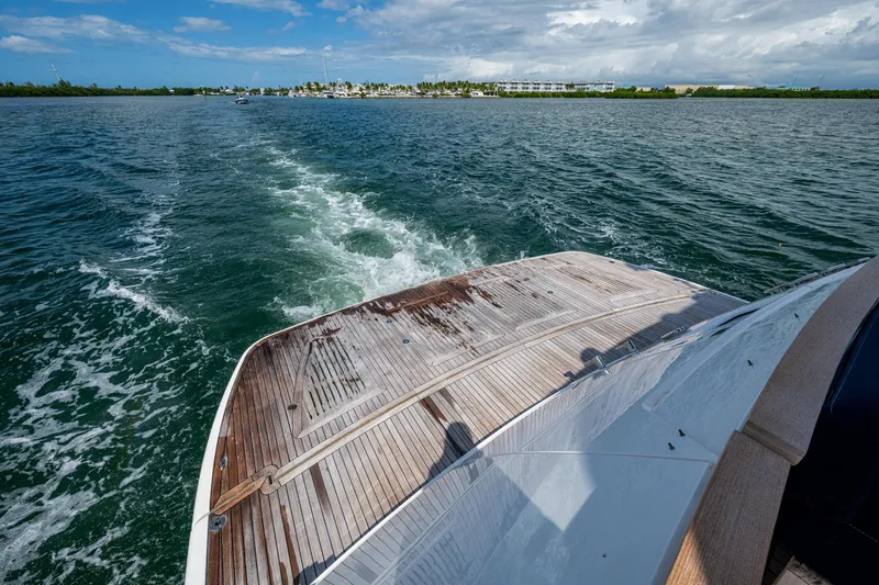 Reset Yacht Photos Pics Fairline 78 Squadron 2015 yacht cruising on open water with scenic shoreline view.