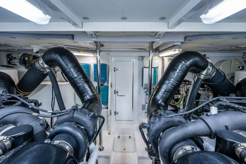 Reset Yacht Photos Pics Engine room of 2015 Fairline 78 Squadron yacht, featuring advanced machinery and piping.