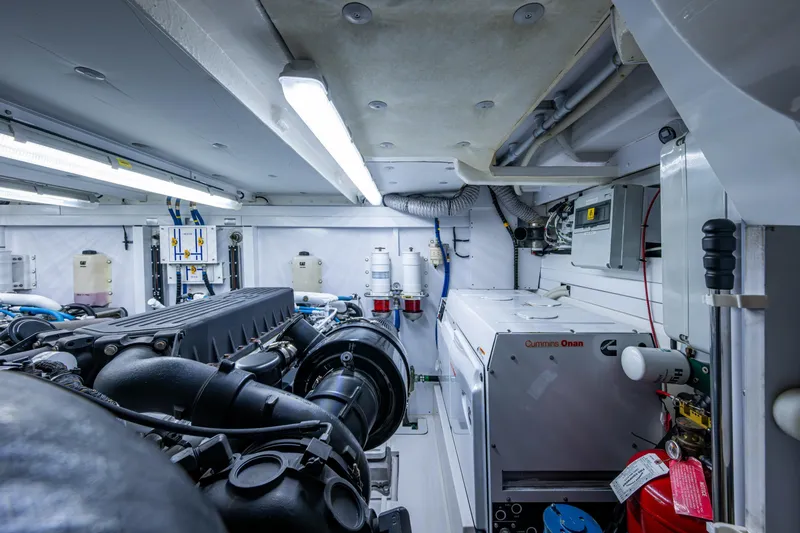 Reset Yacht Photos Pics Engine room of 2015 Fairline 78 Squadron yacht, featuring Cummins Onan generator and advanced machinery.