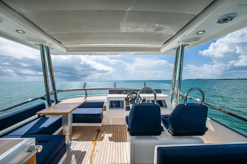 Reset Yacht Photos Pics Luxurious 2015 Fairline 78 Squadron yacht interior with ocean view and elegant seating.