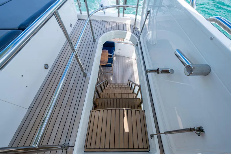 Reset Yacht Photos Pics Staircase on 2015 Fairline 78 Squadron yacht with teak decking and stainless steel railings.