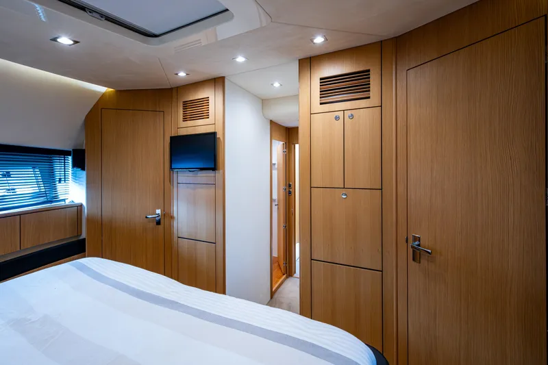 Reset Yacht Photos Pics Luxurious cabin interior of 2015 Fairline 78 Squadron yacht with wood paneling and modern amenities.