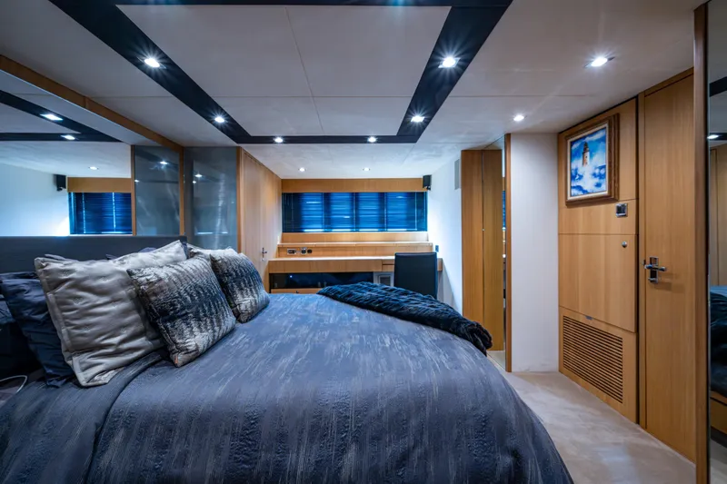 Reset Yacht Photos Pics Luxurious bedroom interior on 2015 Fairline 78 Squadron yacht, featuring modern design and elegant decor.