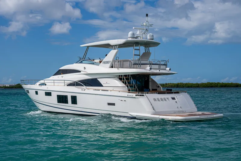 Reset Yacht Photos Pics Luxury 2015 Fairline 78 Squadron yacht cruising on clear blue waters.