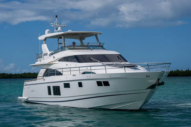Reset Yacht Photos Pics Luxury 2015 Fairline 78 Squadron yacht cruising on clear blue waters.