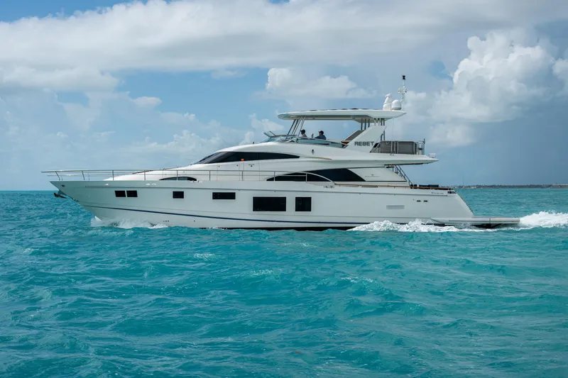 Reset Yacht Photos Pics Luxury 2015 Fairline 78 Squadron yacht cruising on turquoise ocean waters.