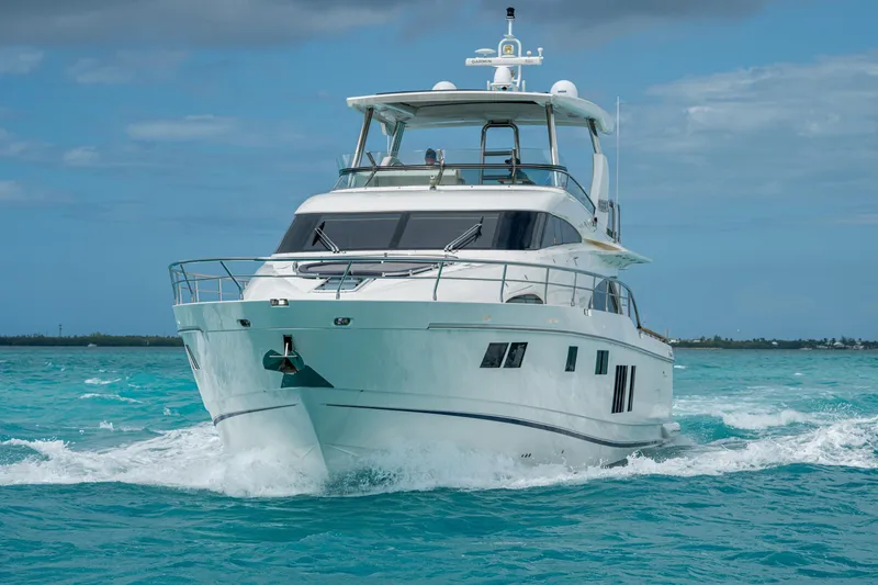 Reset Yacht Photos Pics Luxury Fairline 78 Squadron yacht cruising in turquoise waters, 2015 model.