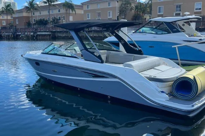 Lowest Priced 280slx In Mint Condition Yacht Photos Pics 2021 Sea Ray SLX 280 boat docked in a marina with calm water.