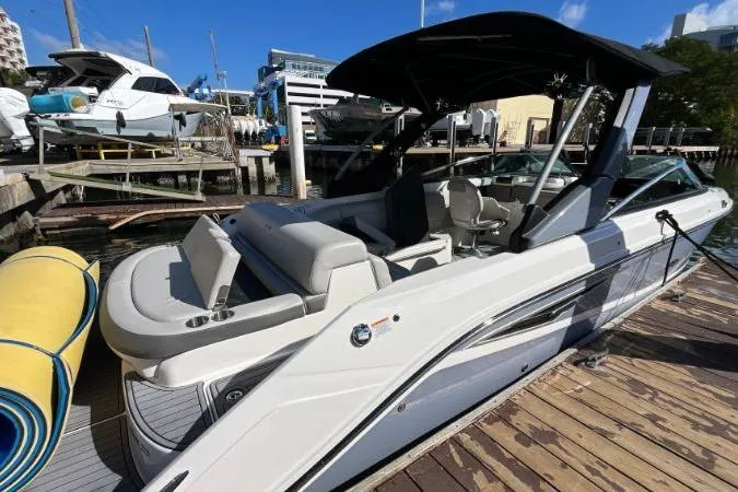 Lowest Priced 280slx In Mint Condition Yacht Photos Pics 2021 Sea Ray SLX 280 boat docked, featuring sleek design and spacious seating.