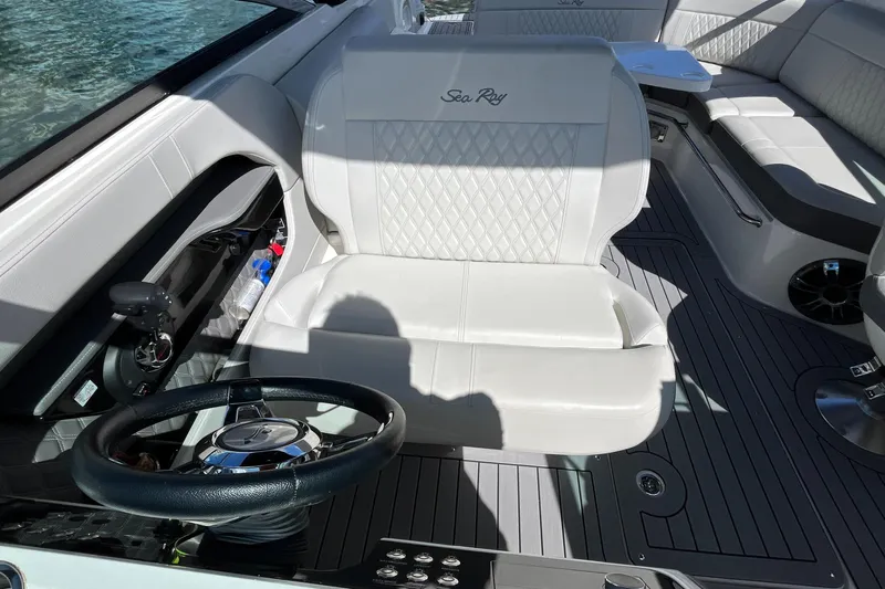 Lowest Priced 280slx In Mint Condition Yacht Photos Pics Interior of 2021 Sea Ray SLX 280 boat with white seating and steering wheel.
