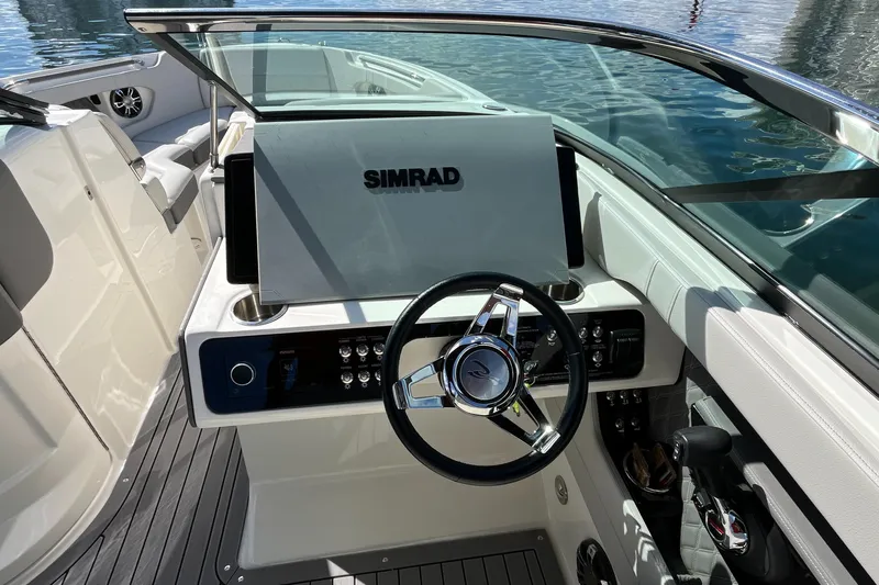 Lowest Priced 280slx In Mint Condition Yacht Photos Pics 2021 Sea Ray SLX 280 boat helm with Simrad display and sleek steering wheel.