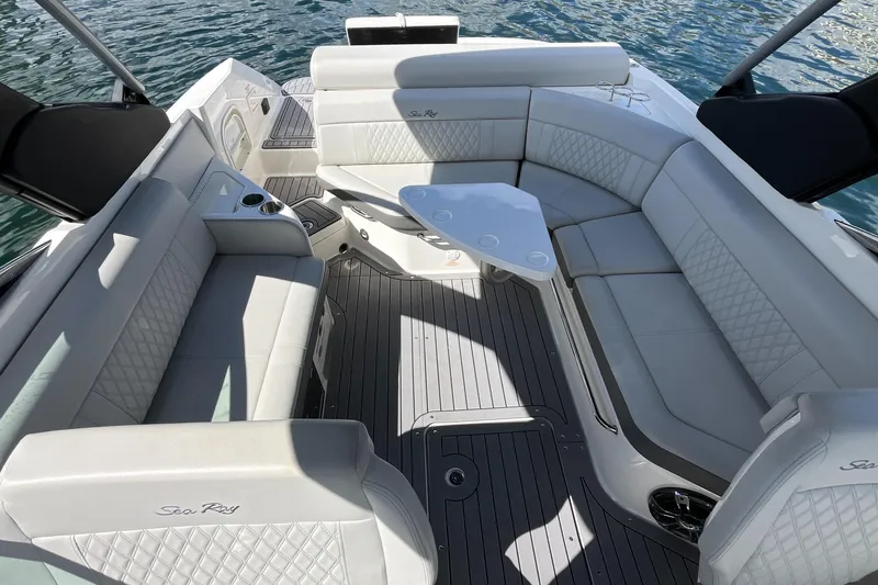 Lowest Priced 280slx In Mint Condition Yacht Photos Pics Luxurious 2021 Sea Ray SLX 280 boat interior with elegant seating and table on water.
