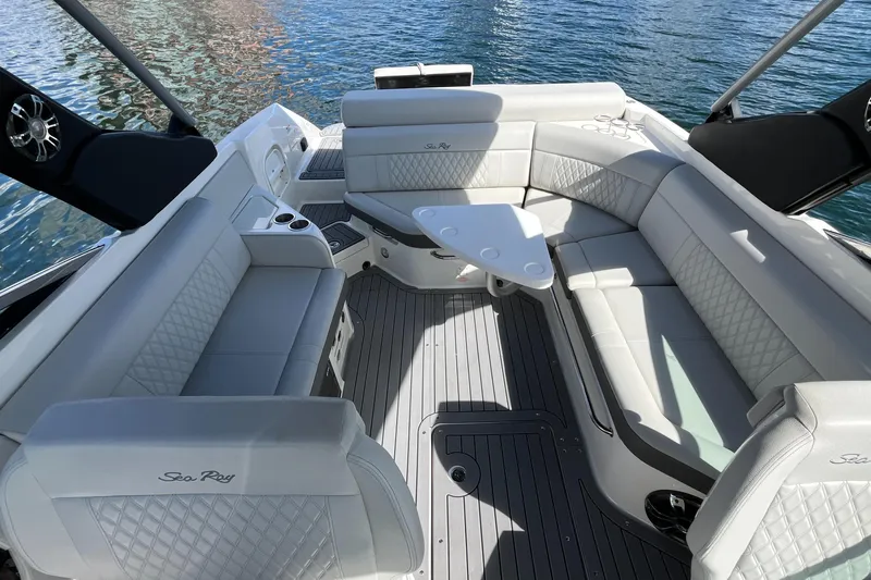 Lowest Priced 280slx In Mint Condition Yacht Photos Pics Luxurious interior of 2021 Sea Ray SLX 280 boat with elegant seating and table.