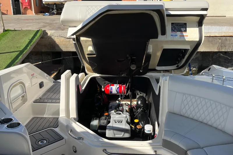 Lowest Priced 280slx In Mint Condition Yacht Photos Pics 2021 Sea Ray SLX 280 boat engine compartment with open hatch, showcasing V8 engine.