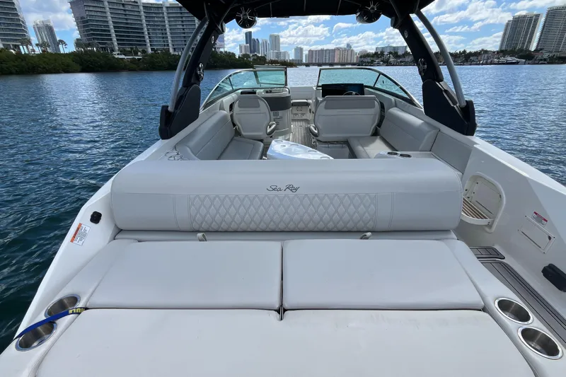Lowest Priced 280slx In Mint Condition Yacht Photos Pics 2021 Sea Ray SLX 280 boat interior with luxurious seating on a calm waterway.