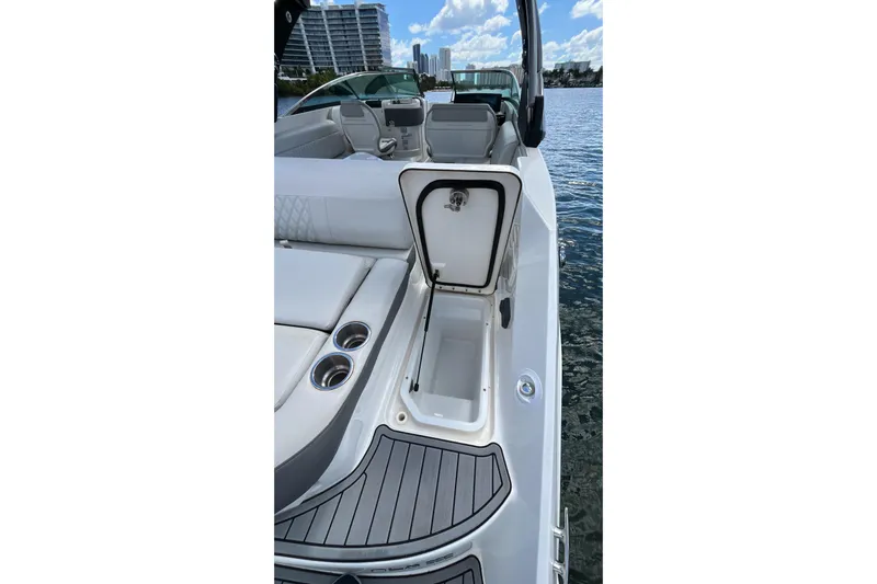 Lowest Priced 280slx In Mint Condition Yacht Photos Pics 2021 Sea Ray SLX 280 boat interior with open storage compartment and cup holders.