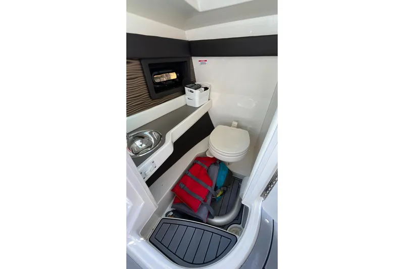 Lowest Priced 280slx In Mint Condition Yacht Photos Pics Interior of 2021 Sea Ray SLX 280 boat bathroom with sink and toilet.