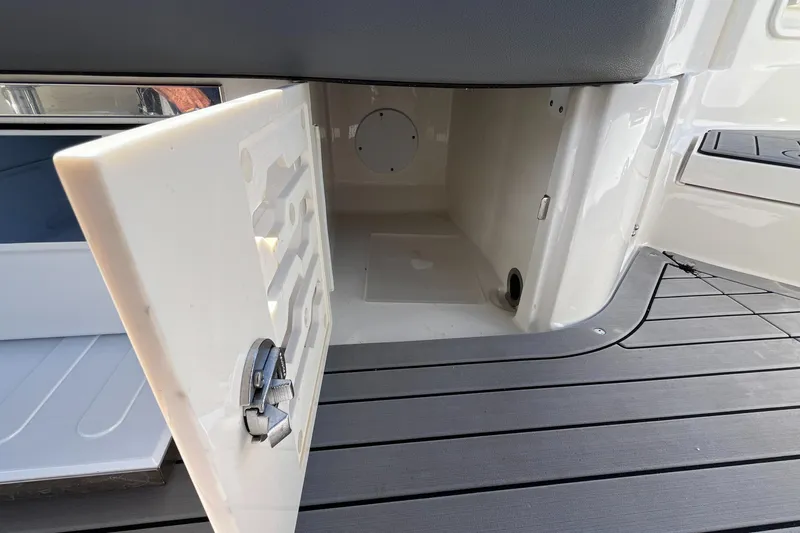 Lowest Priced 280slx In Mint Condition Yacht Photos Pics Open storage compartment on 2021 Sea Ray SLX 280 boat deck.