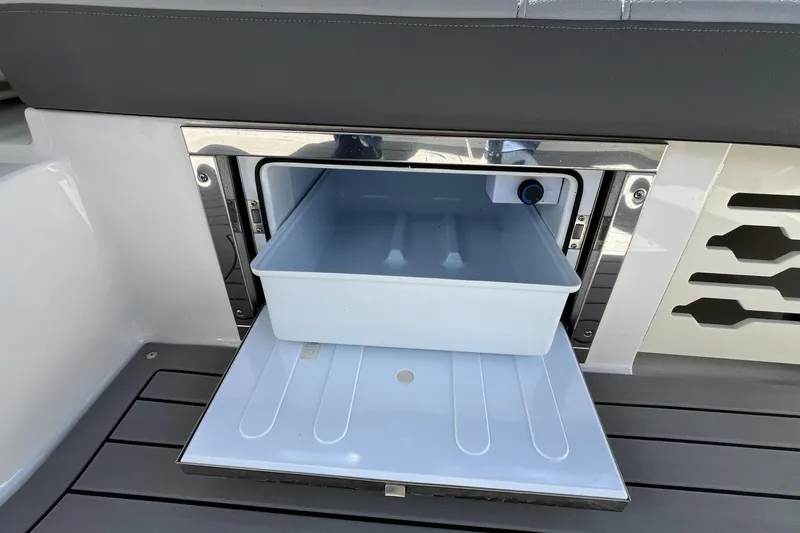 Lowest Priced 280slx In Mint Condition Yacht Photos Pics 2021 Sea Ray SLX 280 boat storage compartment with open drawer on deck.