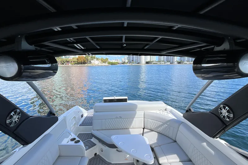 Lowest Priced 280slx In Mint Condition Yacht Photos Pics 2021 Sea Ray SLX 280 boat interior with luxurious seating and scenic waterfront view.