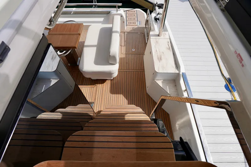  Yacht Photos Pics Luxurious Prestige F5.7 yacht deck with wooden flooring and elegant seating, 2025 model.