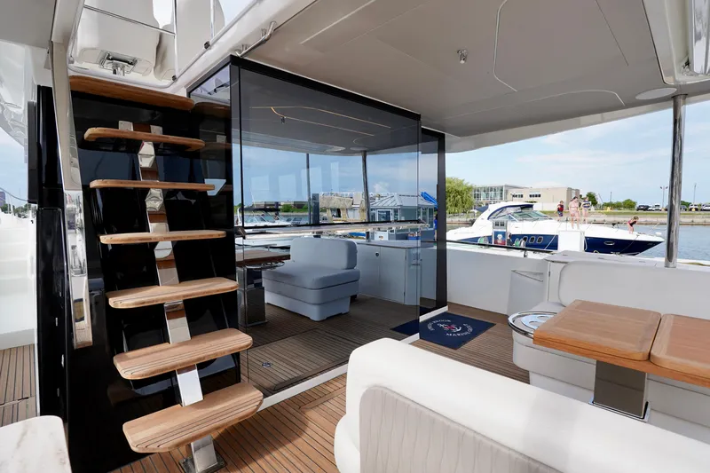  Yacht Photos Pics Luxurious Prestige F5.7 yacht interior, featuring modern design and elegant wooden staircase, 2025 model.
