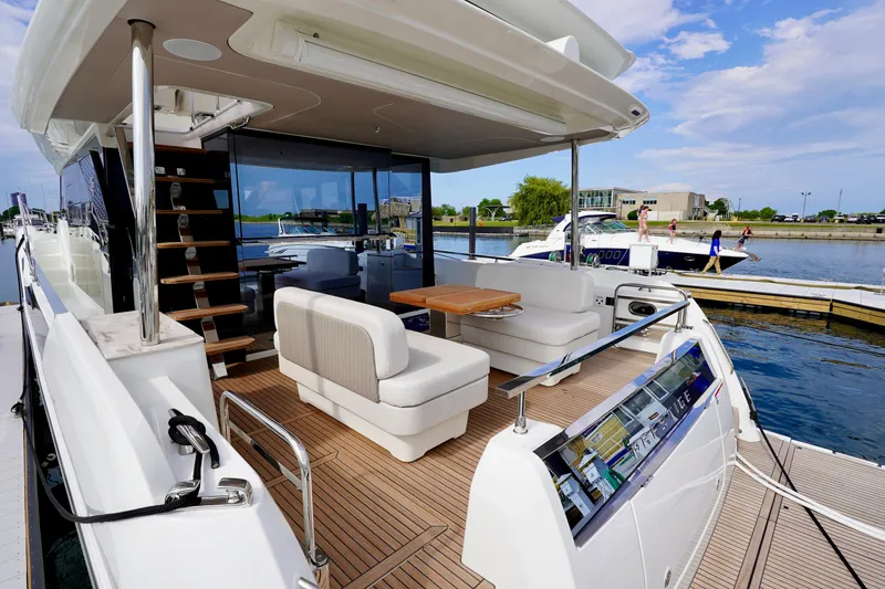  Yacht Photos Pics Luxurious 2025 Prestige F5.7 yacht with elegant deck seating and modern design.