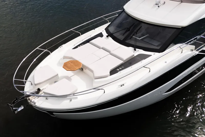  Yacht Photos Pics Prestige F5.7 2025 yacht with sleek design and spacious deck on water.