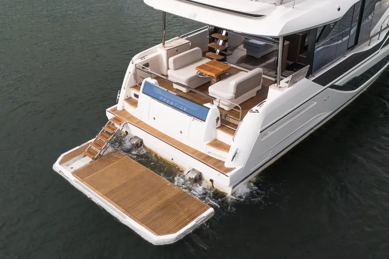 Yacht Photos Pics Luxury Prestige F5.7 yacht, 2025 model, featuring elegant deck and seating area on water.