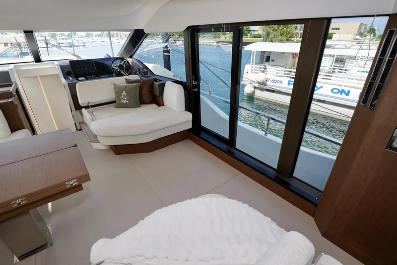  Yacht Photos Pics Luxurious interior of 2025 Prestige F5.7 yacht with modern seating and large windows.