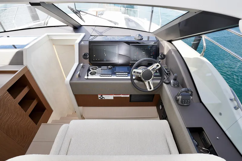  Yacht Photos Pics Modern helm of 2025 Prestige F5.7 yacht with advanced navigation controls.