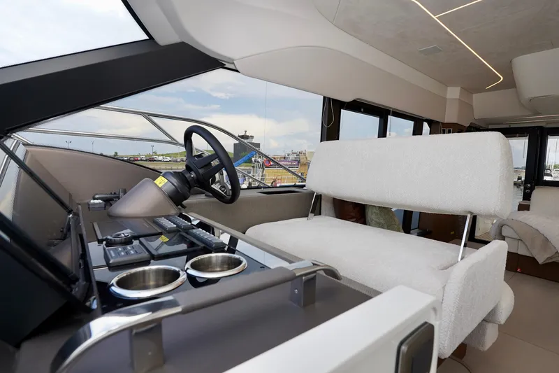  Yacht Photos Pics Luxurious interior of 2025 Prestige F5.7 yacht with modern helm and seating.