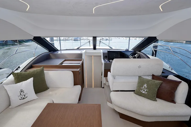 Yacht Photos Pics Luxurious interior of 2025 Prestige F5.7 yacht with elegant seating and scenic ocean view.