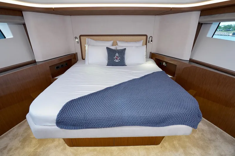  Yacht Photos Pics Luxurious bedroom interior of 2025 Prestige F5.7 yacht with elegant bedding.