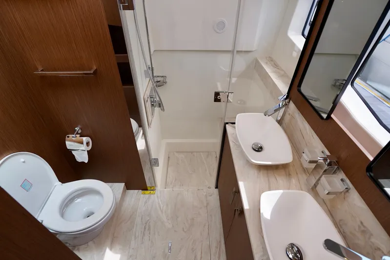  Yacht Photos Pics Luxurious bathroom in 2025 Prestige F5.7 yacht with dual sinks and modern fixtures.