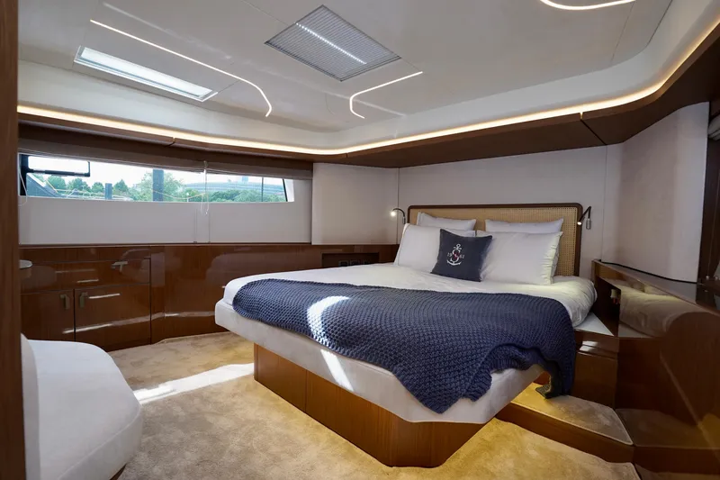  Yacht Photos Pics Luxurious cabin interior of 2025 Prestige F5.7 yacht with elegant bedding and modern design.